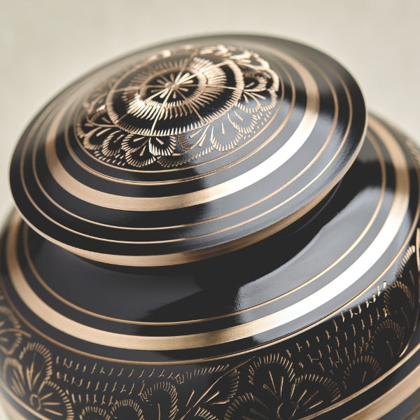 Radiance Elite urn with its lid, showcasing the black and gold design.