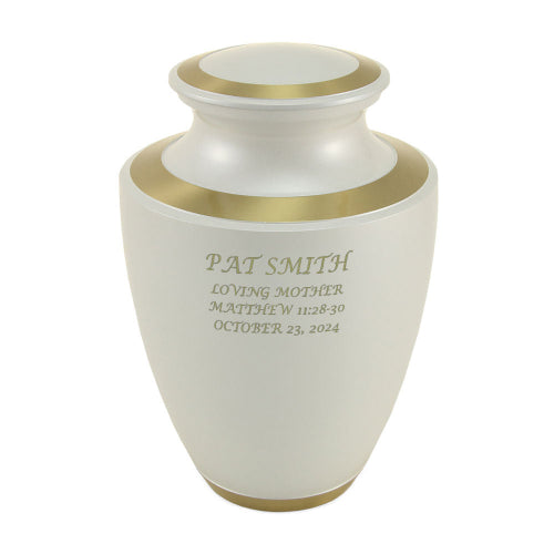 The Trinity Pearl Memorial Urn, available at Magnolia Cremations, featuring a smooth white high-gloss finish with gold accents. The urn is engraved with a personalized tribute, demonstrating the option for custom engraving.