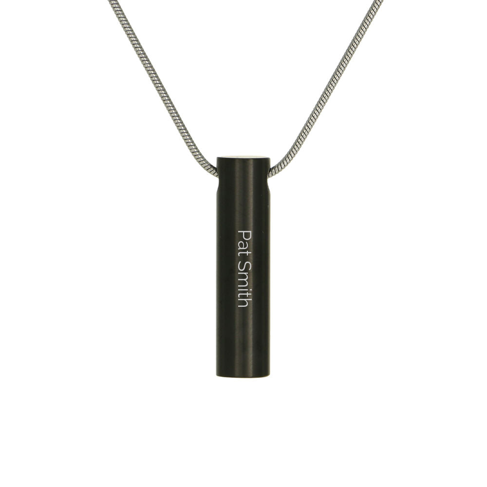 Onyx cylinder necklace with a delicate chain.