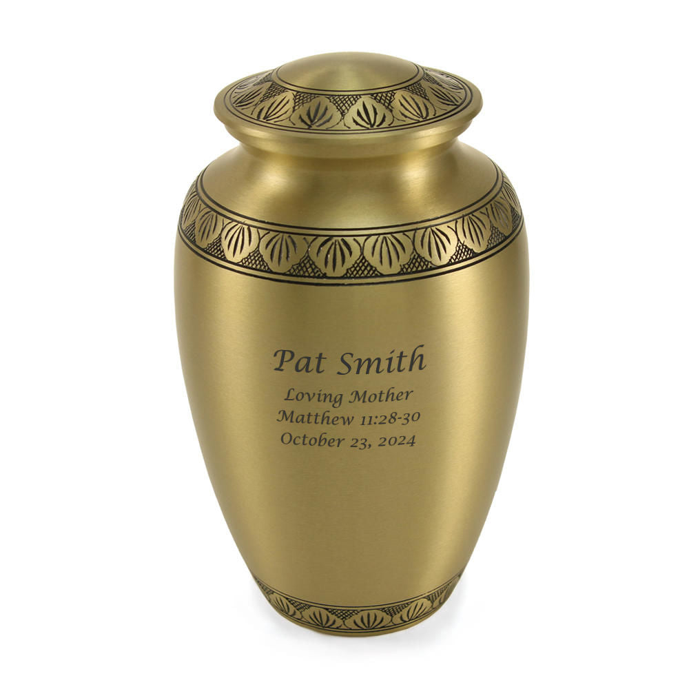 Large brass cremation urn with a bronze finish and decorative black bands. Suitable for holding ashes.